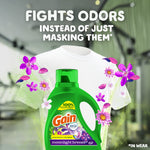 Gain Moonlight Breeze detergent bottle in front of a white T-shirt with floral accents and text 'FIGHTS ODORS INSTEAD OF JUST MASKING THEM*'.