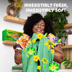Person happily holding fresh towels with a Gain dryer sheets box visible and text ‘IRRESISTIBLY FRESH, IRRESISTIBLY SOFT’