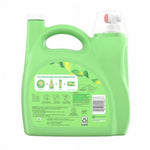 Rear view of a light-green Gain fabric softener container with product information panel and barcode.