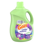 Green plastic jug of Gain +odor defense fabric softener showing full front label and integrated handle