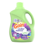 Studio shot of a green Gain +odor defense fabric softener bottle on white background showing front label