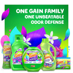 Promotional display of multiple Gain Odor Defense product forms with green background and headline