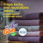 Stack of folded towels with Gain and Febreze logos and text claiming lavender scent and odor neutralizing benefits