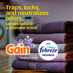 Stack of folded towels with Gain and Febreze logos and text about trapping and neutralizing odors, lavender scent