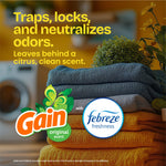 Stacked folded towels with Gain and Febreze logos and text about trapping and neutralizing odors against a home background