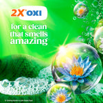 Bright green graphic with '2X OXI' claim, floral bubble and foam promoting a fresh, clean scent