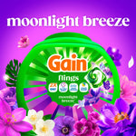 Vibrant product art of Gain Flings moonlight breeze tub surrounded by purple and pink flowers