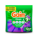 Front-facing pouch of Gain flings Moonlight Breeze laundry pacs with green and purple design and 12 ct badge