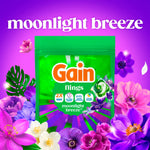 Gain flings pouch centered on purple background with 'moonlight breeze' headline and floral border around the package