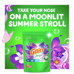 Promotional green graphic with a Gain flings! Moonlight Breeze pouch surrounded by purple flowers and headline text