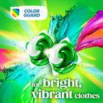 Two green-and-white detergent pods over colorful liquid splash with 'Color Guard' badge and 'bright, vibrant clothes' text