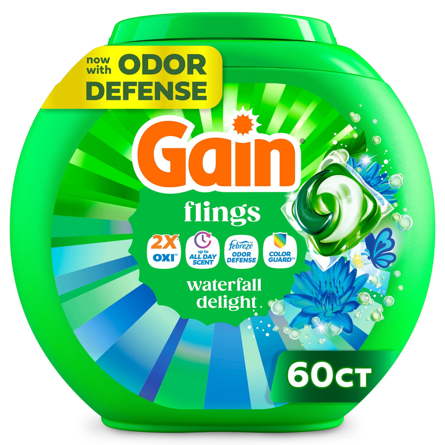 Green plastic tub of Gain Flings laundry pods labeled 'waterfall delight' with 60ct callout and floral graphics