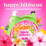 Green Gain fabric softener bottle displayed with large ‘happy hibiscus’ headline and tropical flower illustration