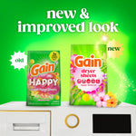 Promotional graphic showing old and new Gain Happy Hibiscus dryer sheets packaging side by side on green background