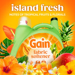 Gain fabric softener jug surrounded by tropical fruits and flowers with 'island fresh' headline