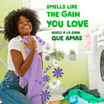 Happy person hugging a purple towel in a laundry room with illustrated lavender blossoms and product slogan