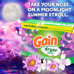 Gain Moonlight Breeze dryer sheets box amid moonlit floral background with headline about a moonlight summer stroll