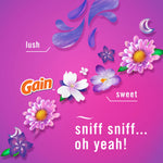 Graphic floral artwork with Gain logo and playful copy describing the scent as lush and sweet on a pink background.