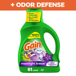 Green Gain liquid detergent bottle labeled Moonlight Breeze with floral graphics and '61 loads' on white background and orange header reading '+ ODOR DEFENSE'.