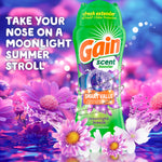 Gain Moonlight Breeze scent booster bottle surrounded by purple flowers and splash graphics with promotional tagline