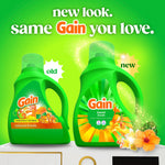 Promotional graphic showing old and new Gain Island Fresh detergent bottles with 'new look' text on green background