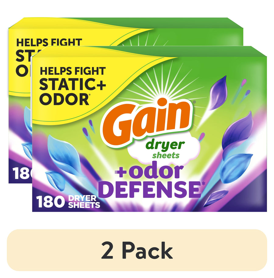 Two overlapping Gain Odor Defense dryer sheet boxes with bright green and purple packaging and 'helps fight static + odor' text