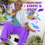 Smiling person seated on a washer with floating purple and blue leaf graphics and Gain dryer sheets branding and 'Helps Fight Static & Odor' text