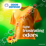 Dramatized orange shirt with soap bubbles and 'odor defense' badge promoting Gain's odor-fighting detergent benefits