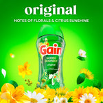 Gain Scent Booster bottle centered on a bright green background surrounded by yellow and white flowers and 'original' headline.