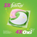 Close-up stylized image of a pink-white-green Gain detergent pac with 3X febreze and 4X Oxi branding on a green background.
