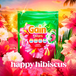 Gain plus Happy Hibiscus pouch set against a tropical floral background with surrounding hibiscus blooms