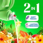 Pouring spout dispensing liquid over tropical flowers with '2 in 1' and soft touch/lasting freshness icons