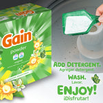 Promotional image of Gain powder box and scoop pouring detergent into a washing machine with bilingual text