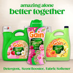 Gain product lineup with Tango Twist scent booster bottle centered between detergent and fabric softener