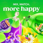 Two Gain products pouring into a floral scene with headline 'mix, match, more happy' on a green background emphasizing scent mixing.