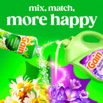 Graphic mixing scent booster bottle and Gain fabric softener pouring with colorful flowers and text 'mix, match, more happy' on green background