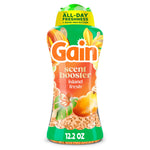 Tall Gain scent booster bottle labeled Island Fresh with visible orange beads and tropical floral packaging