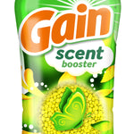 Close-up of Gain scent booster label showing the brand logo, flower artwork and yellow scent beads visible in design.