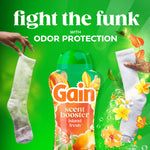 Gain scent booster bottle centered between two socks with text ‘fight the funk’ and odor protection callout