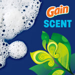 Close-up foam and stylized green leaf graphic with the Gain logo and the word ‘SCENT’