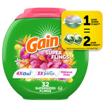 Green oval Gain Super Flings container with hibiscus floral artwork and pink lid, labeled 32 supersized flings.