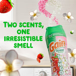 Gain Tango bottle surrounded by strawberries and blossoms with text 'Two scents, one irresistible smell'