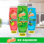 Three Gain Ultra Clean EZ-Squeeze dish soap bottles in watermelon, original (green) and blue variants displayed on a kitchen counter