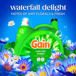 Gain Waterfall Delight detergent bottle surrounded by blue and white flowers with product name and scent notes