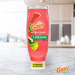Single Gain Ultra Clean summer watermelon dish soap bottle standing upright on a marble countertop with blurred kitchen background