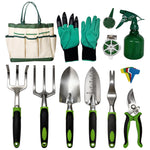 Flat lay of a gardening tool kit: tote bag, gloves, spray bottle, labels, coil and seven hand tools with green-black handles