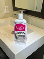 Gel-Gloss Kitchen & Bath Polish bottle standing on a bathroom sink countertop in front of a mirror