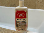 Gel-Gloss Kitchen & Bath Polish bottle positioned on a bathroom ledge with tub and tile behind it