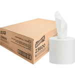 Cardboard shipping box labeled Genuine Joe 23600 next to a white center-pull paper towel roll with a sheet pulled out