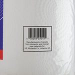 Close-up photograph of barcode and manufacturing text printed on the clear-wrapped surface of a Genuine Joe paper towel roll.